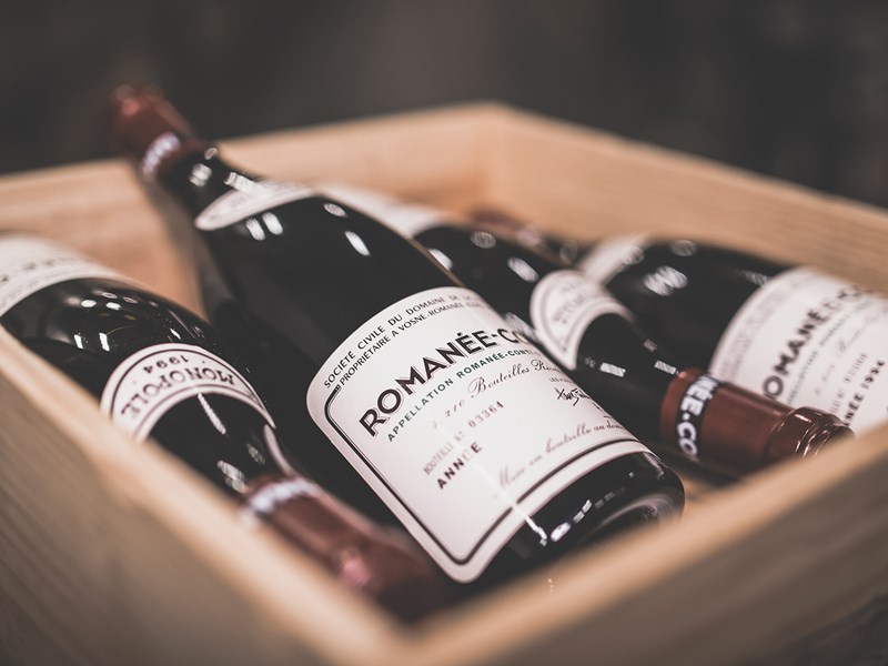 wooden case with bottles of romanee-conti