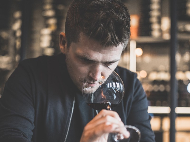Mads Jensen, CEO at RareWine Group, tasting wine